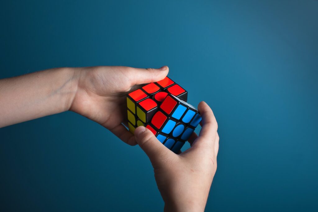 hands solving rubix cube