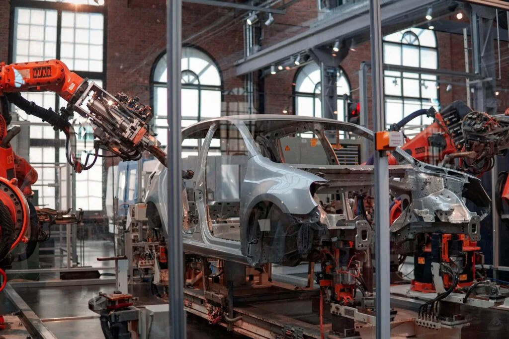 car being built in assembly line