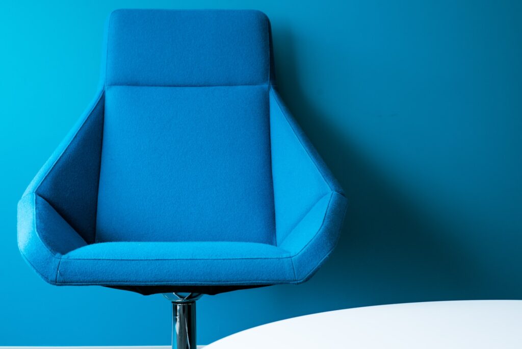 blue padded swivel chair