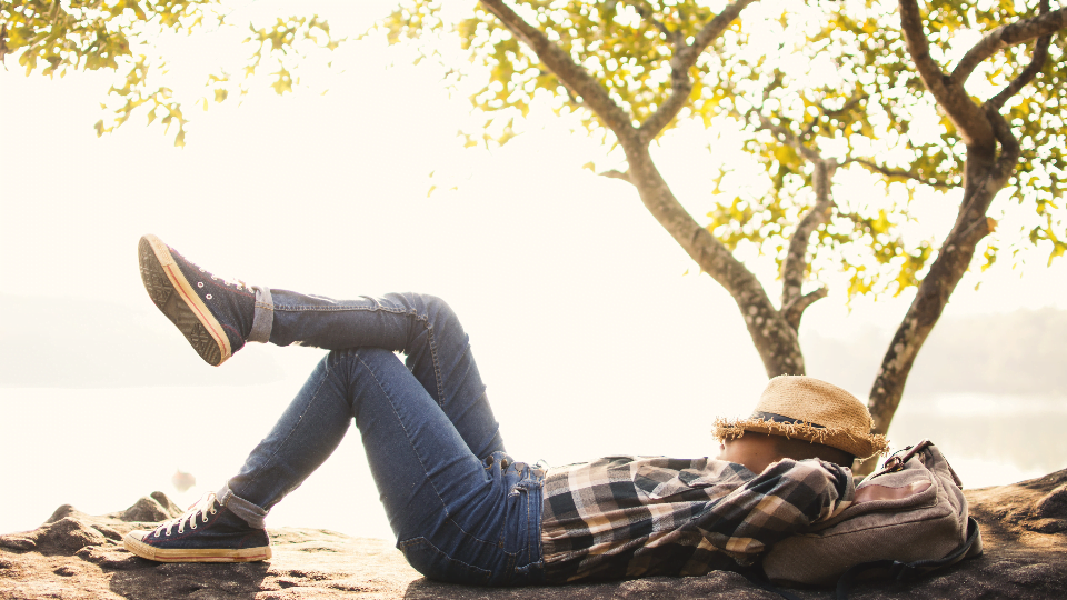 How Toxic Productivity Can Derail Your Best Laid Plans as a Small Business Owner 5 person laying down outside