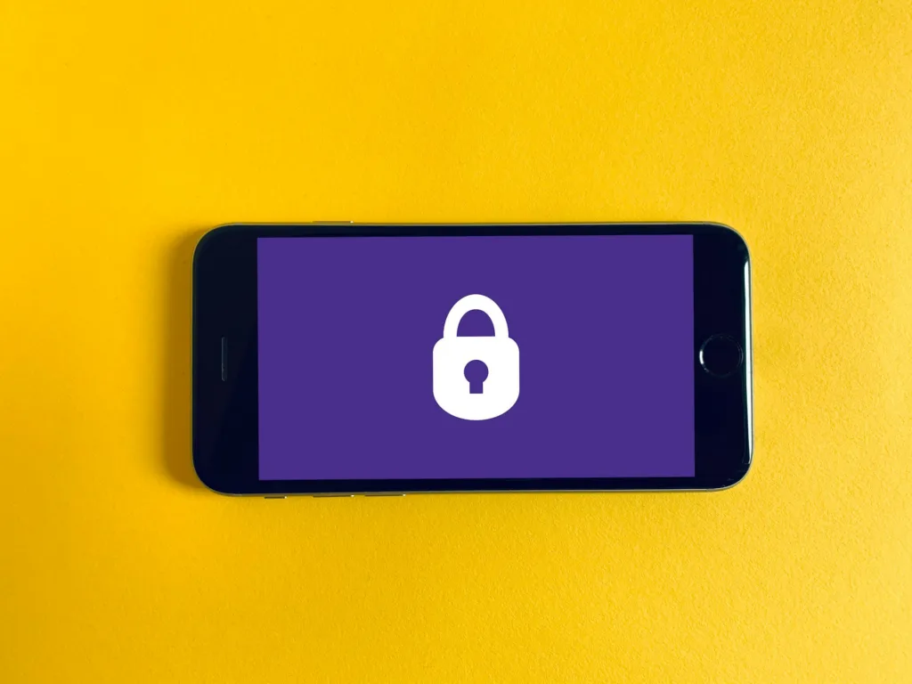 Become an Expert in Calendar Management: Finally, Crack the Code of Google Workspace for Virtual Assistants 4 iphone on a yellow background with purple screen and lock